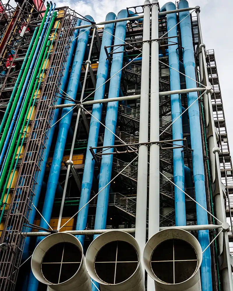 External installations, structure and colored pipelines making the facade of a building